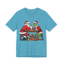 Load image into Gallery viewer, Santa vs The Grinch – Funny Christmas Graphic Tee (Unisex) Heather Aqua