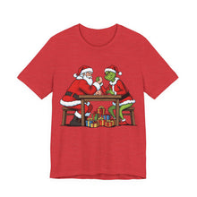 Load image into Gallery viewer, Santa vs The Grinch – Funny Christmas Graphic Tee (Unisex) Heather Red