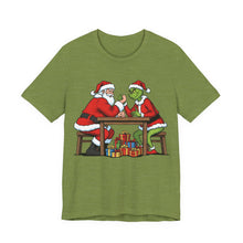Load image into Gallery viewer, Santa vs The Grinch – Funny Christmas Graphic Tee (Unisex) Heather Green
